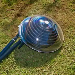 90230-2 | PisciManía Outdoor industrial floodlight with a transparent domed cover resting on grass, connected by two hoses/tubes.