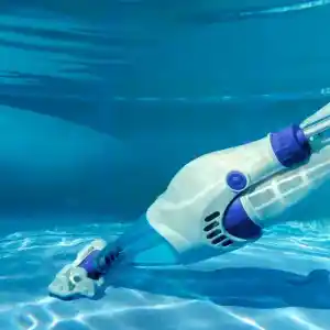 vcb10-4 | PisciManía White and purple robotic pool cleaner gliding along the pool floor underwater.