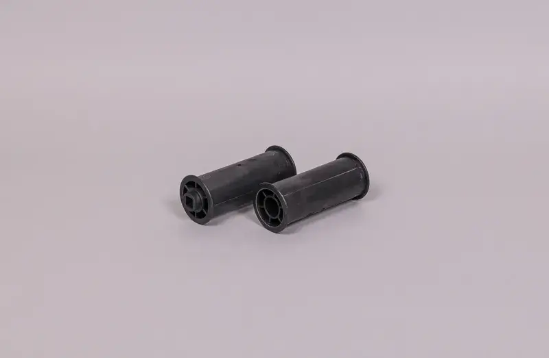 wr000314-3 | PisciManía Two black cylindrical bushings with hollow centers on a light gray background.